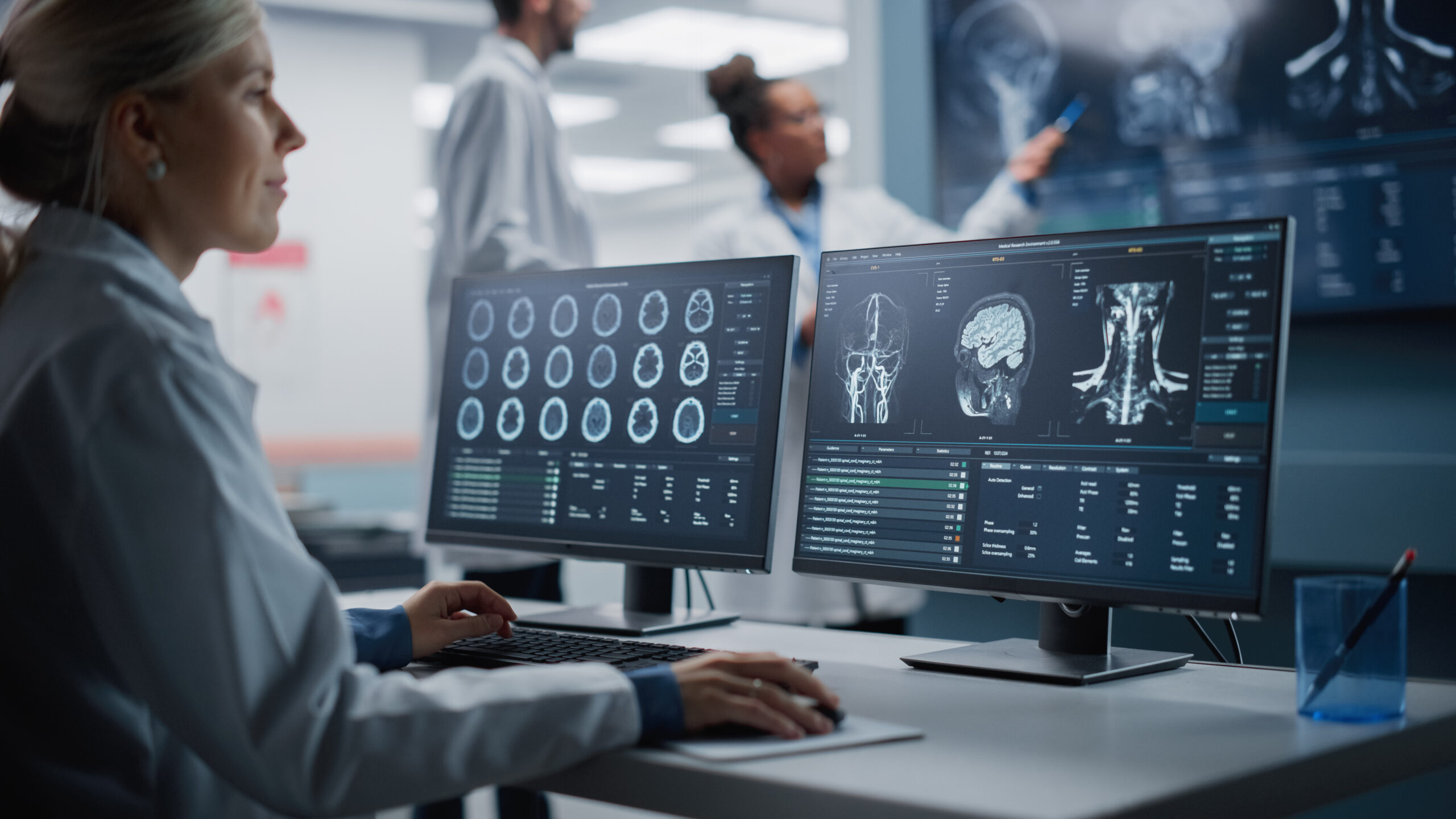 Medical Hospital Health Care Lab: Portrait of Female Medical Scientist Using Computer with Brain Scan MRI Images, Finding Cure. Professional Neurologist Analysing CT Scan Finding Cure for Sick Patient